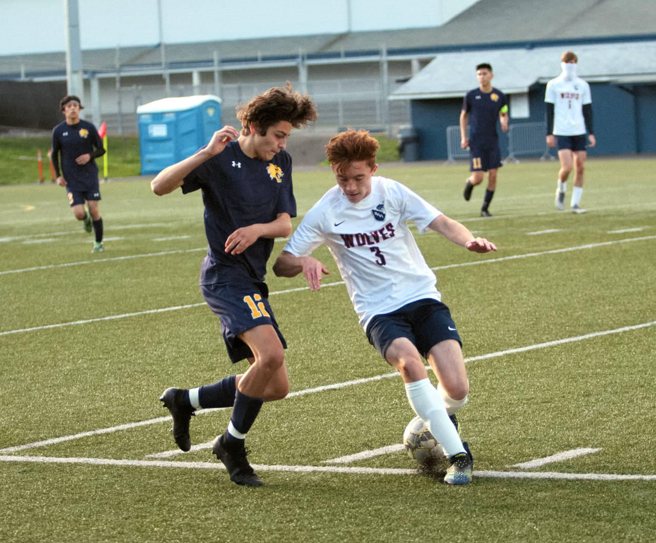 RYAN SPARKS | THE DAILY WORLD Aberdeen’s Carlos Mendoza (12) gets past Black Hills’ Zak Gilal during the first half of the Bobcats’ 4-0 win in a 2A District 4 Tournament game on Saturday at Stewart Field in Aberdeen.