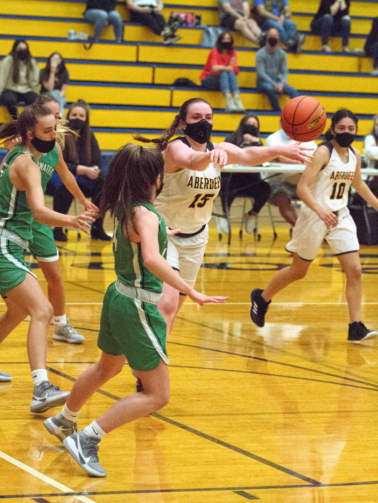 RYAN SPARKS | THE DAILY WORLD Aberdeen’s Zoe Filan (15) passes the ball during the second half of the Bobcats’ 72-19 season-opening loss on Monday at Sam Benn Gym in Aberdeen.