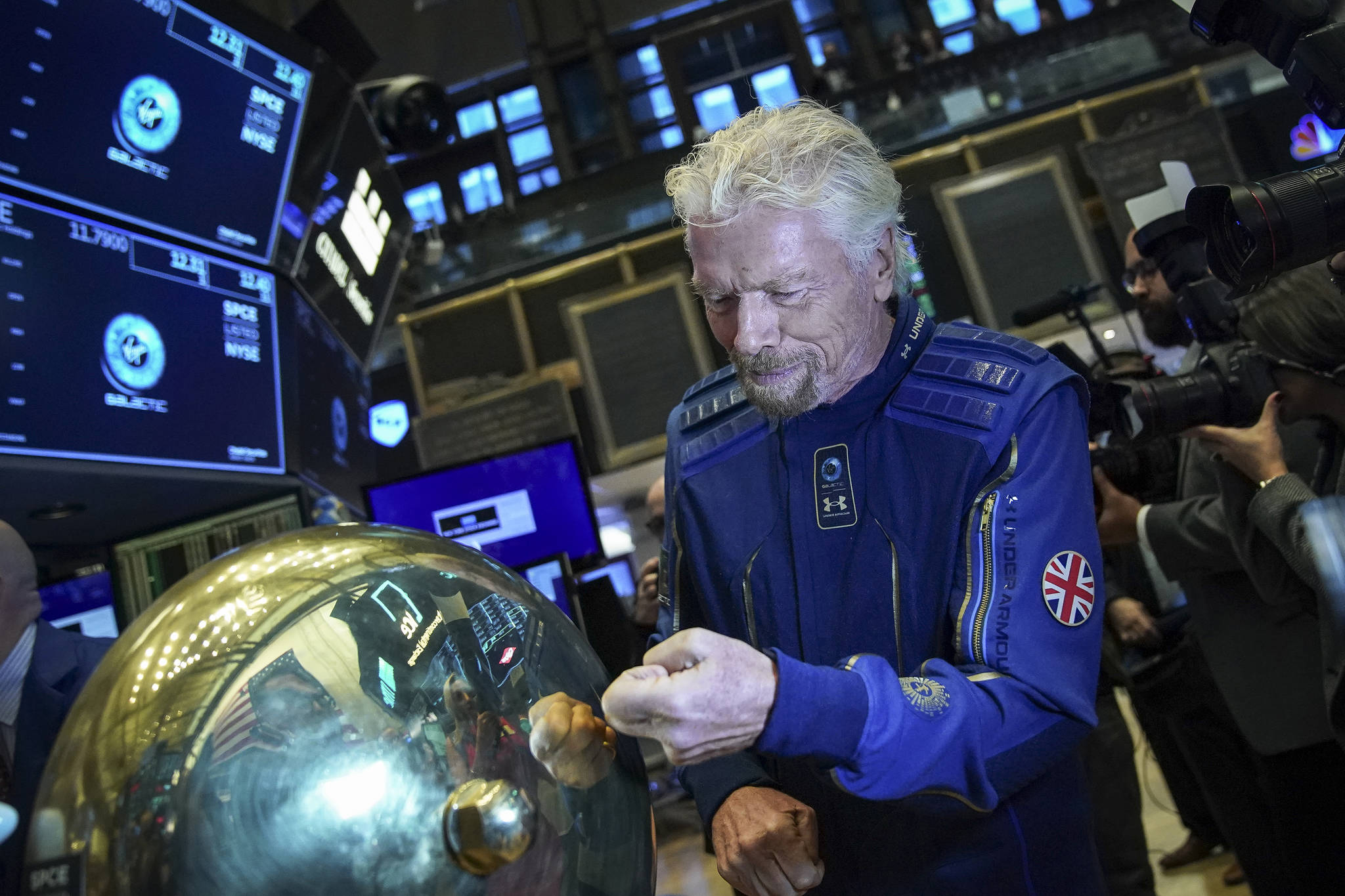 Drew Angerer/Getty Images 
In this photo from October 28, 2019, Sir Richard Branson, founder of Virgin Galactic, arrives on the floor of the New York Stock Exchange before ringing a ceremonial bell to promote the first day of trading of Virgin Galactic Holdings shares in New York City. On Monday evening, Branson’s space tourism venture said it was reviewing the timing of its next flight test after discovering unspecified “fatigue and stress” on the airplane used to carry the spacecraft aloft.