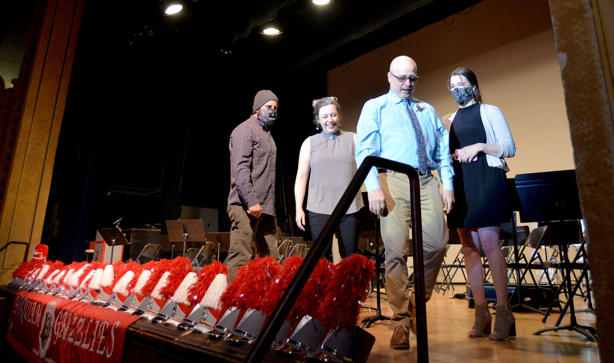 DAVE HAVILAND | THE DAILY WORLD
From left to right, Michael White, Emily White, Roger White and Carly Giles. White’s adult children escorted him off stage after an emotional entry and before many emotional presentations at the 7th Street Theatre in his honor Saturday.