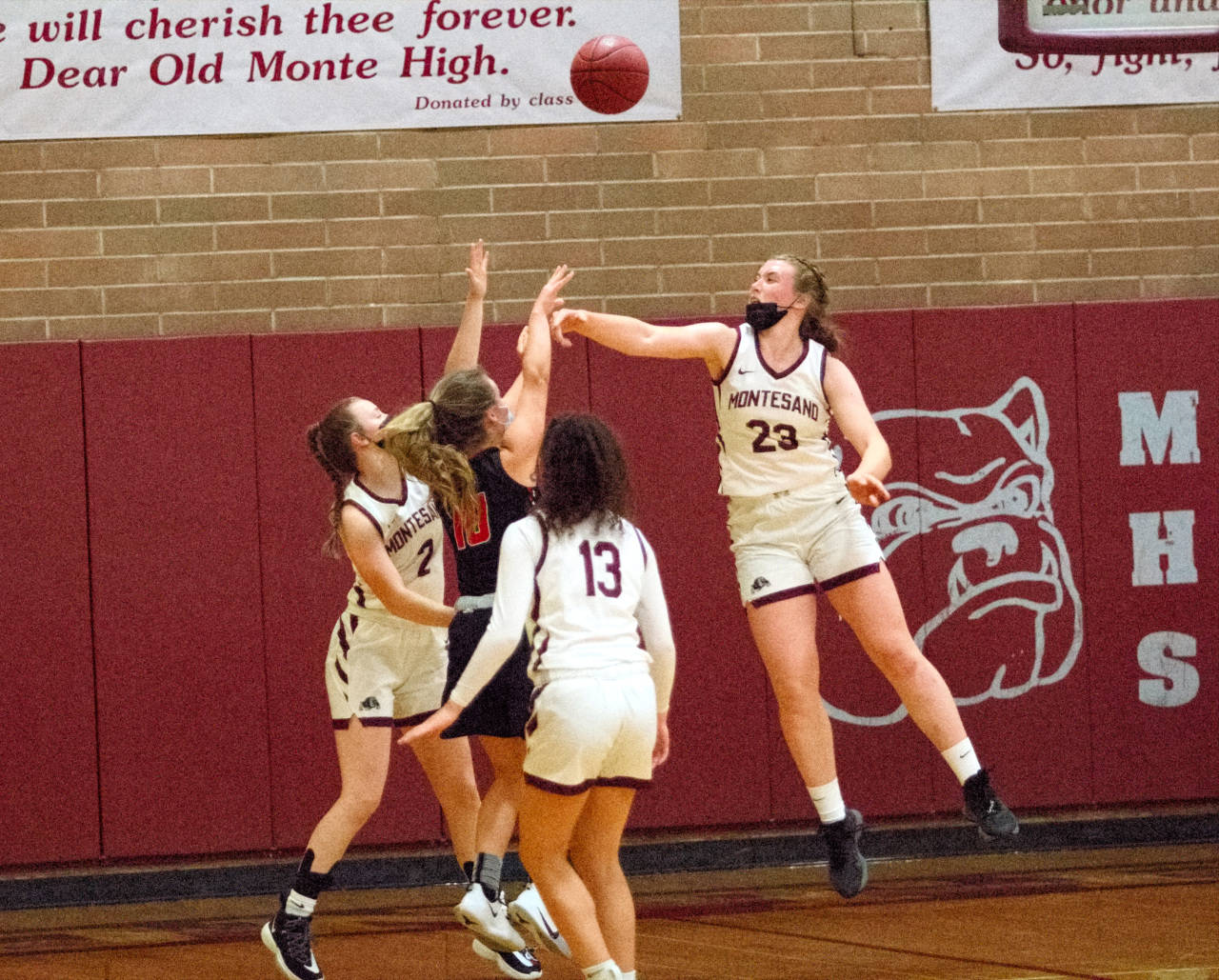 RYAN SPARKS | THE DAILY WORLD
Montesano’s Paige Lisherness (23) and Cassadie Golding (2) challenge the shot of Tenino’s Grace Vestal during the Bulldogs’ 57-43 win on Tuesday at Montesano High School.