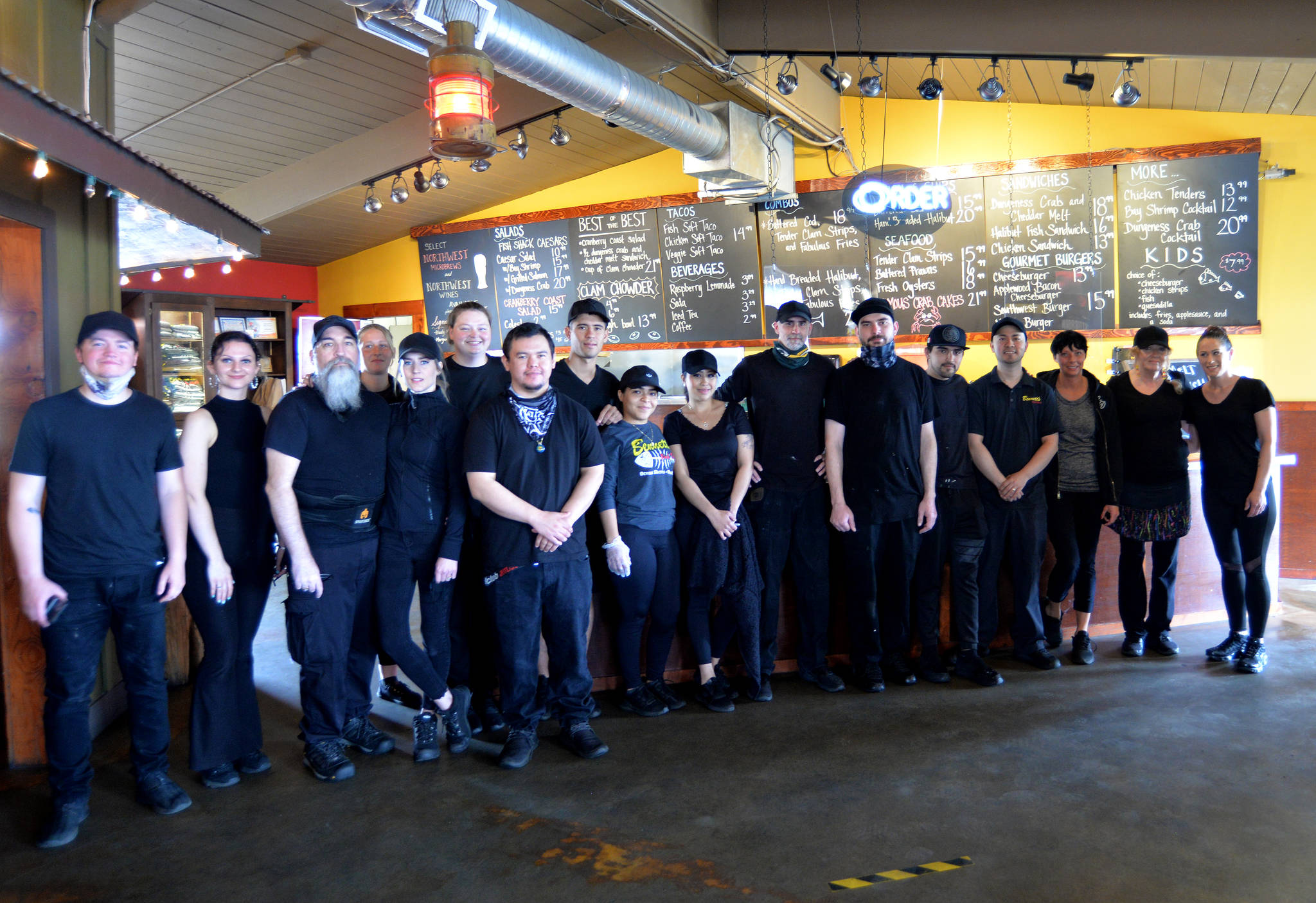 Employees of Bennett’s Fish Shack in Ocean Shores took a moment out of their busy lunch rush Friday to pose for a photo, which was followed by a round of applause from the diners.