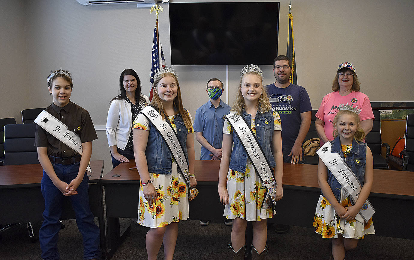DAN HAMMOCK | THE DAILY WORLD 
McCleary Bear Festival royalty presented Mayor Brenda Orffer and members of the city council with 2021 Bear Festival pins Friday. Front row, from left, Jr. Prince Nathan Johnston, Sr. Queen Koral Young, Sr. Princess Taryn Ferrier, Jr. Princess Lola Van Blaricom. Back row, from left, Orffer, Councilman Jaron Heller, Councilman Brycen Huff, Councilwoman Joy Iversen.