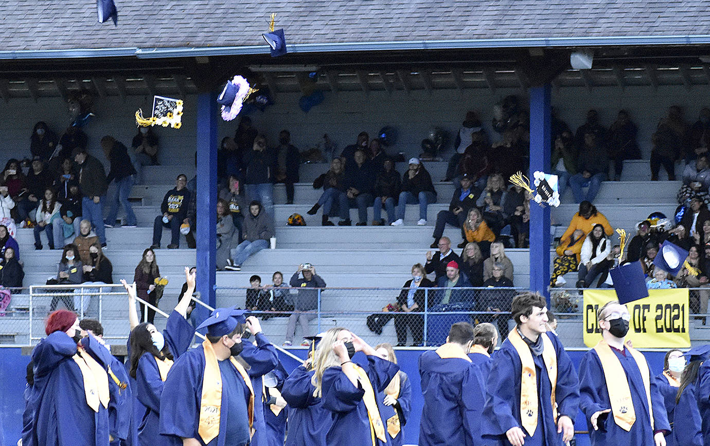 DAN HAMMOCK | THE DAILY WORLD
Mortarboards fly at the end of Aberdeen High School graduation at Stewart Field on Friday evening.