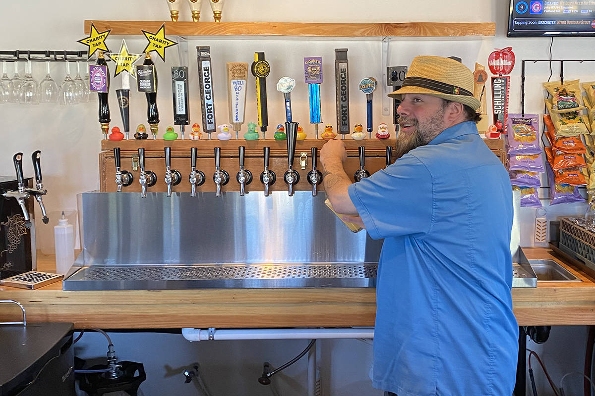 The glass is always half full! Beer Manager, Chris Shiffman pulls a pint.