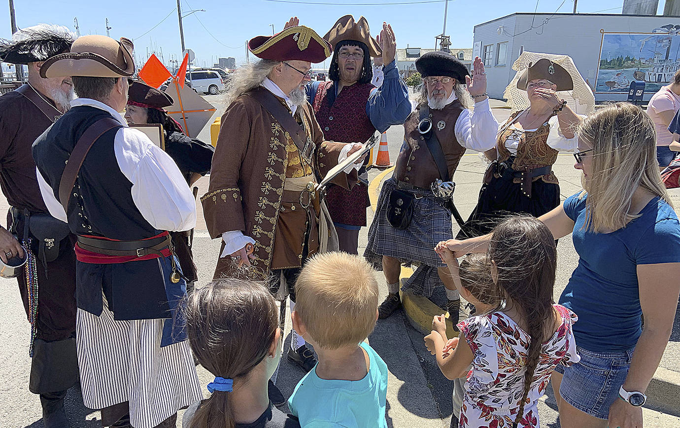 DAN HAMMOCK | THE DAILY WORLD 
The Columbia River Association of Pirates, who call themselves the C.R.A.P. Crew, recruit new crew members at Rusty Scuppers Pirate Daze in Westport on Saturday.