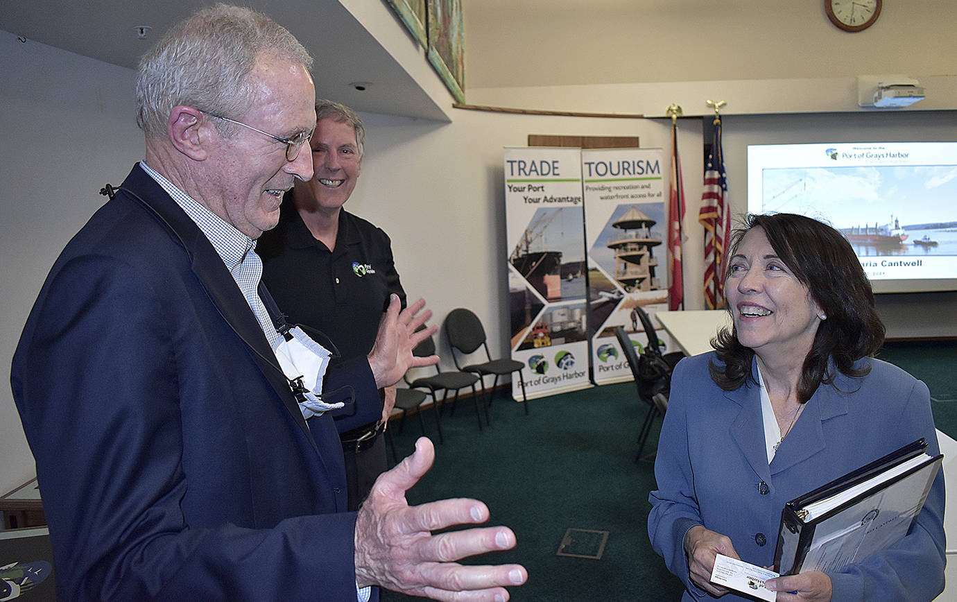 DAN HAMMOCK | THE DAILY WORLD 
Sen. Maria Cantwell chats with Port of Grays Harbor Commissioner Tom Quigg at Port headquarters Wednesday. Cantwell was in town to talk about potential funding options for the East Aberdeen rail separation project. In the background is Port deputy executive director Leonard Barnes.