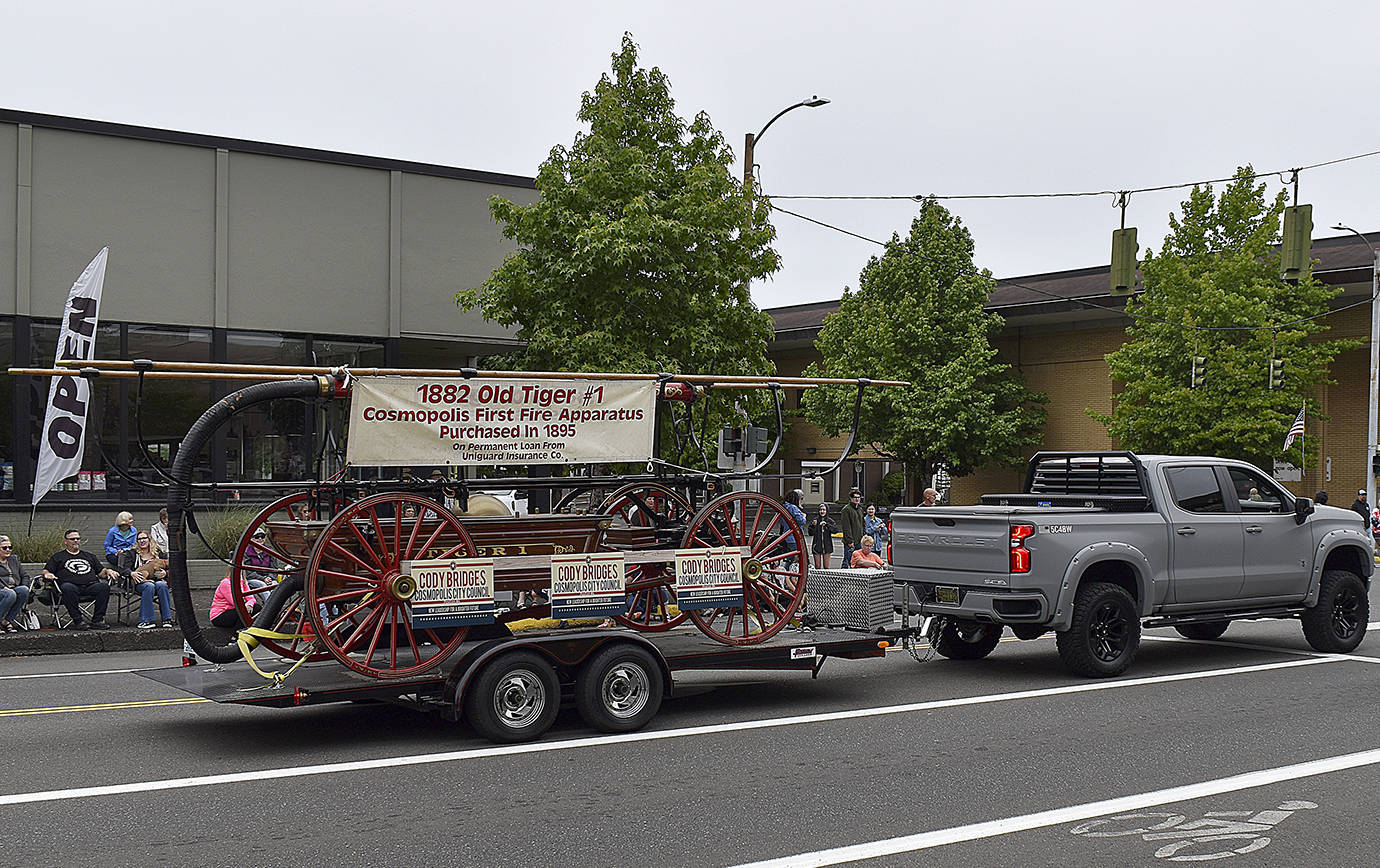 DAN HAMMOCK | THE DAILY WORLD 
Cosmopolis’ first fire apparatus, the 1882 Old Tiger #1, made its way down Market Street in the Aberdeen Founders Day parade.