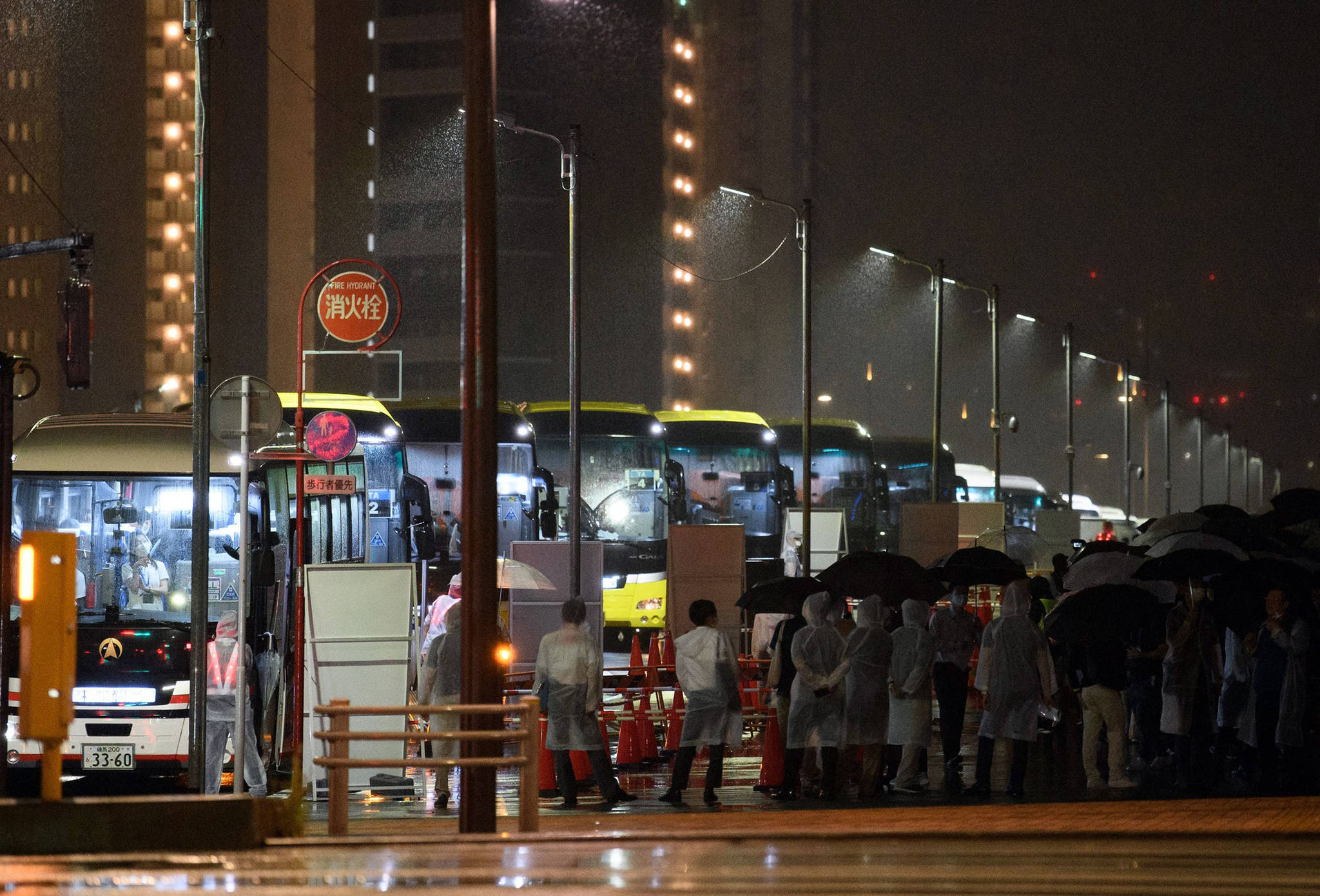 Akio Kon | Getty Images | TNS 
Buses prepare to travel near the Olympic and Paralympic Village in Tokyo on June 20, 2021, during a transport operations simulation for the opening and closing ceremonies of the Tokyo Olympic Games.