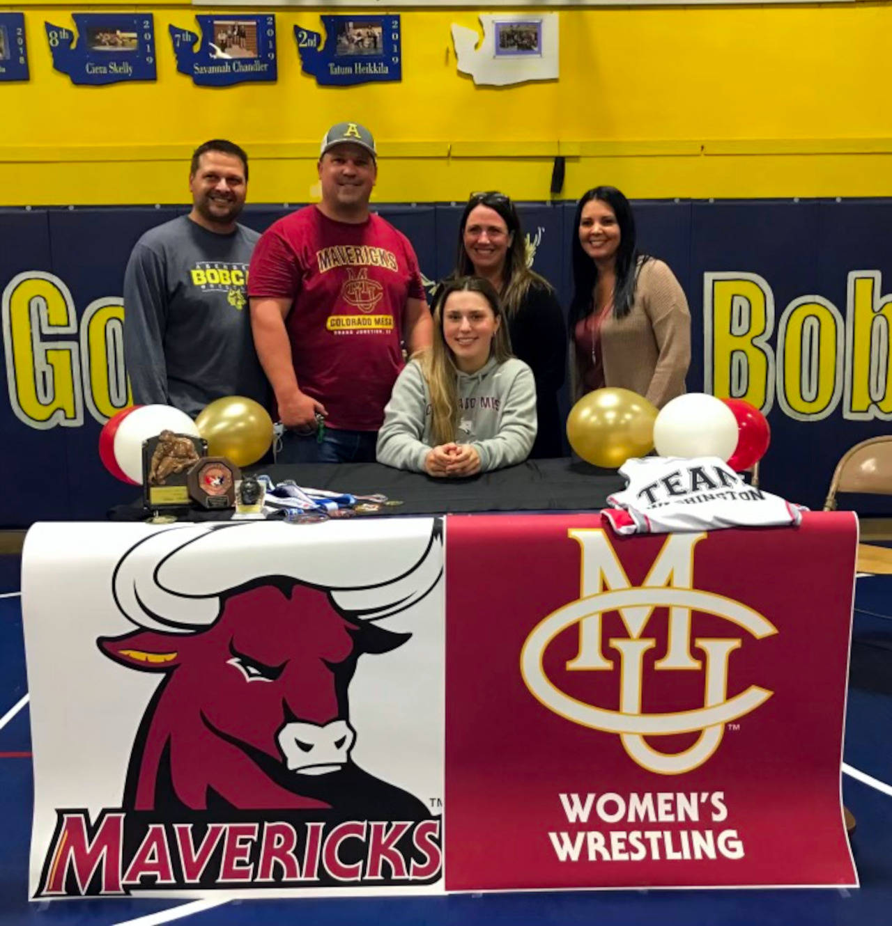 SUBMITTED PHOTO
Aberdeen High School senior wrestler Tatum Heikkila, sitting, signed a Letter of Intent in June to compete for Colorado Mesa University beginning this fall.