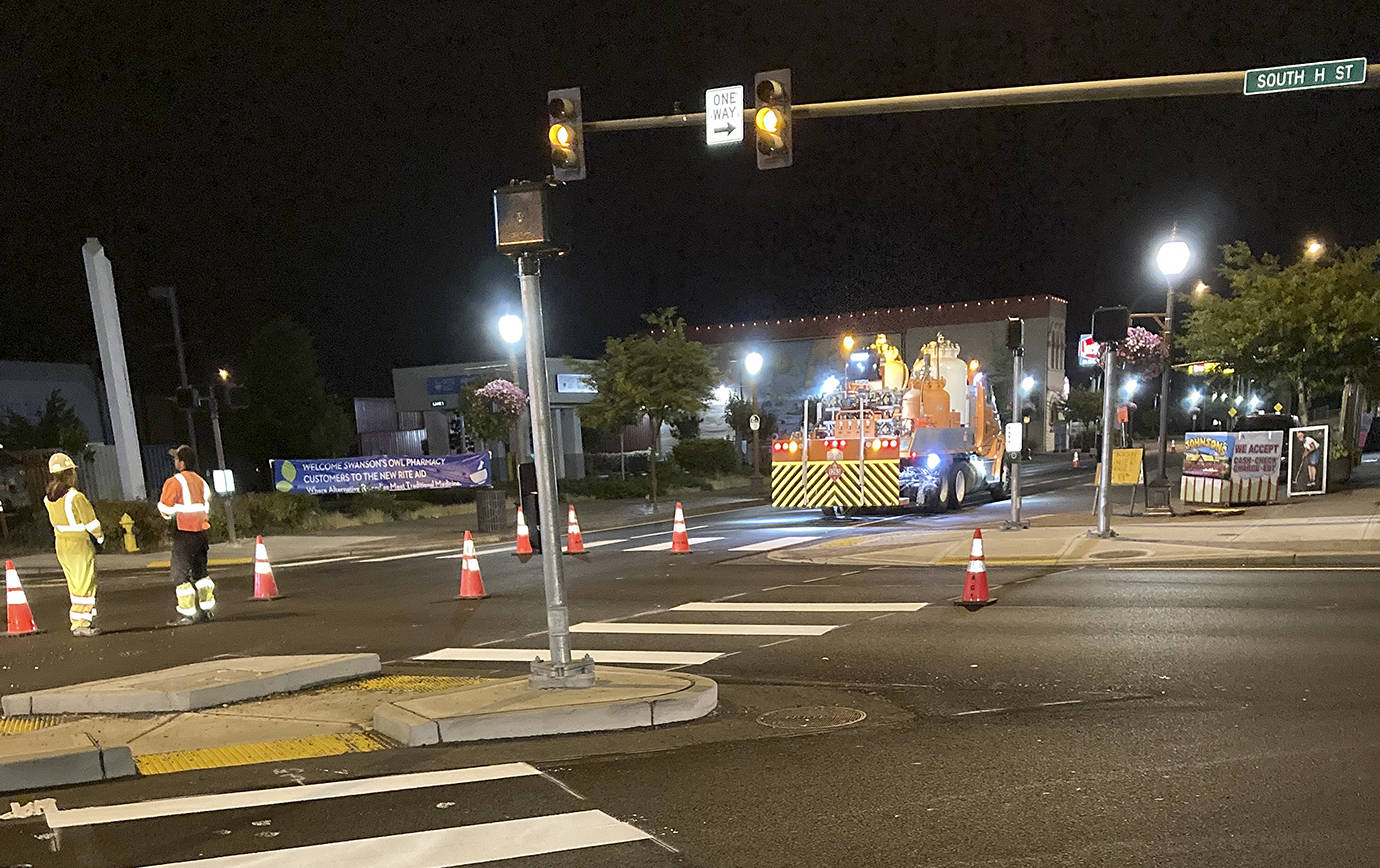 The new ADA ramps, pavement and striping on Heron Street really pop at night. Here crews put the finishing touches on the state Department of Transportation project on Heron and H Street. (Courtesy Department of Transportation)