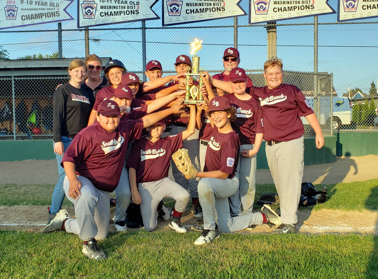 RYAN SPARKS | THE DAILY WORLD
South Beach Little League poses for a photo after winning the 10-12 TOC championship on Tuesday at Nelson Field in Montesano.