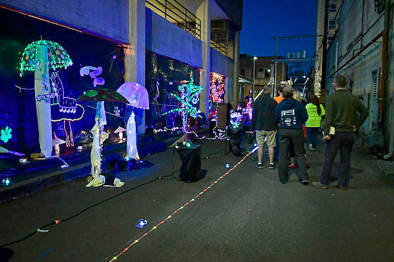 courtesy of Darrell Westmoreland 
Downtown Aberdeen alleys were lit up Saturday night for the Rain Glow Festival. Participants walked through colorful “worlds” set up by volunteers.