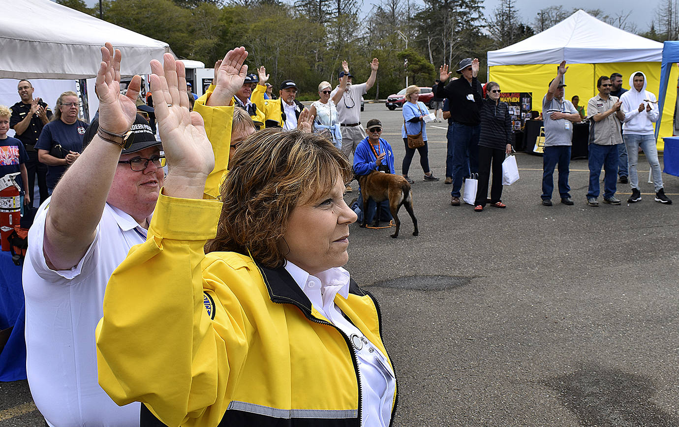DAN HAMMOCK | THE DAILY WORLD 
The many volunteers who gave their time and energy to the county’s COVID-19 pandemic response were honored Saturday. Those attending the Emergency Preparedness Expo were asked to raise their hands to be recognized.