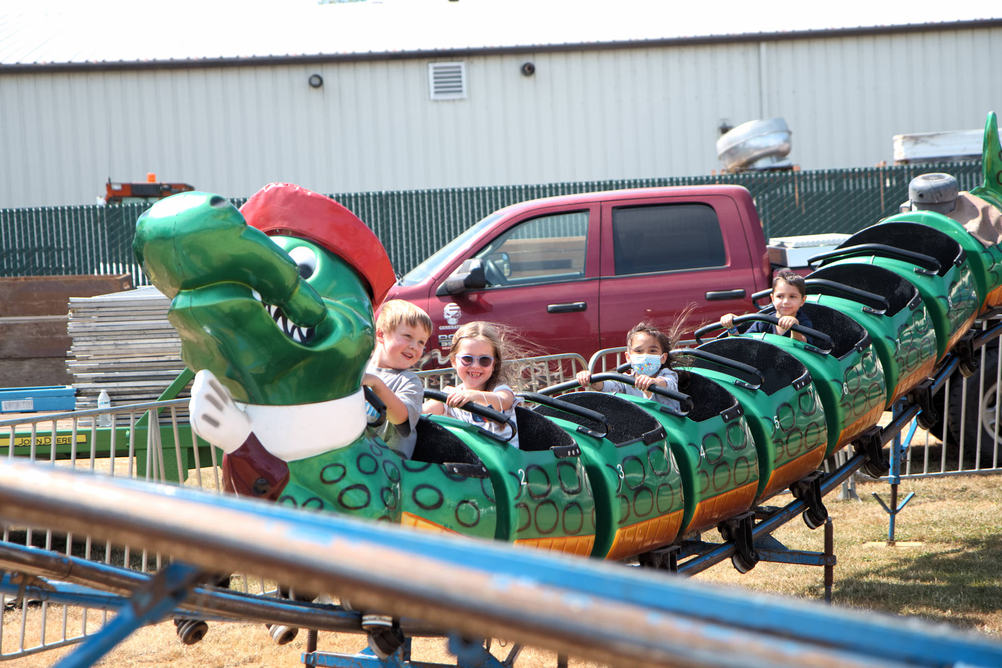 RYAN SPARKS | THE DAILY WORLD Fair attendees ride the Go Gator roller coaster on Thursday at the Grays Harbor County Fair in Elma.