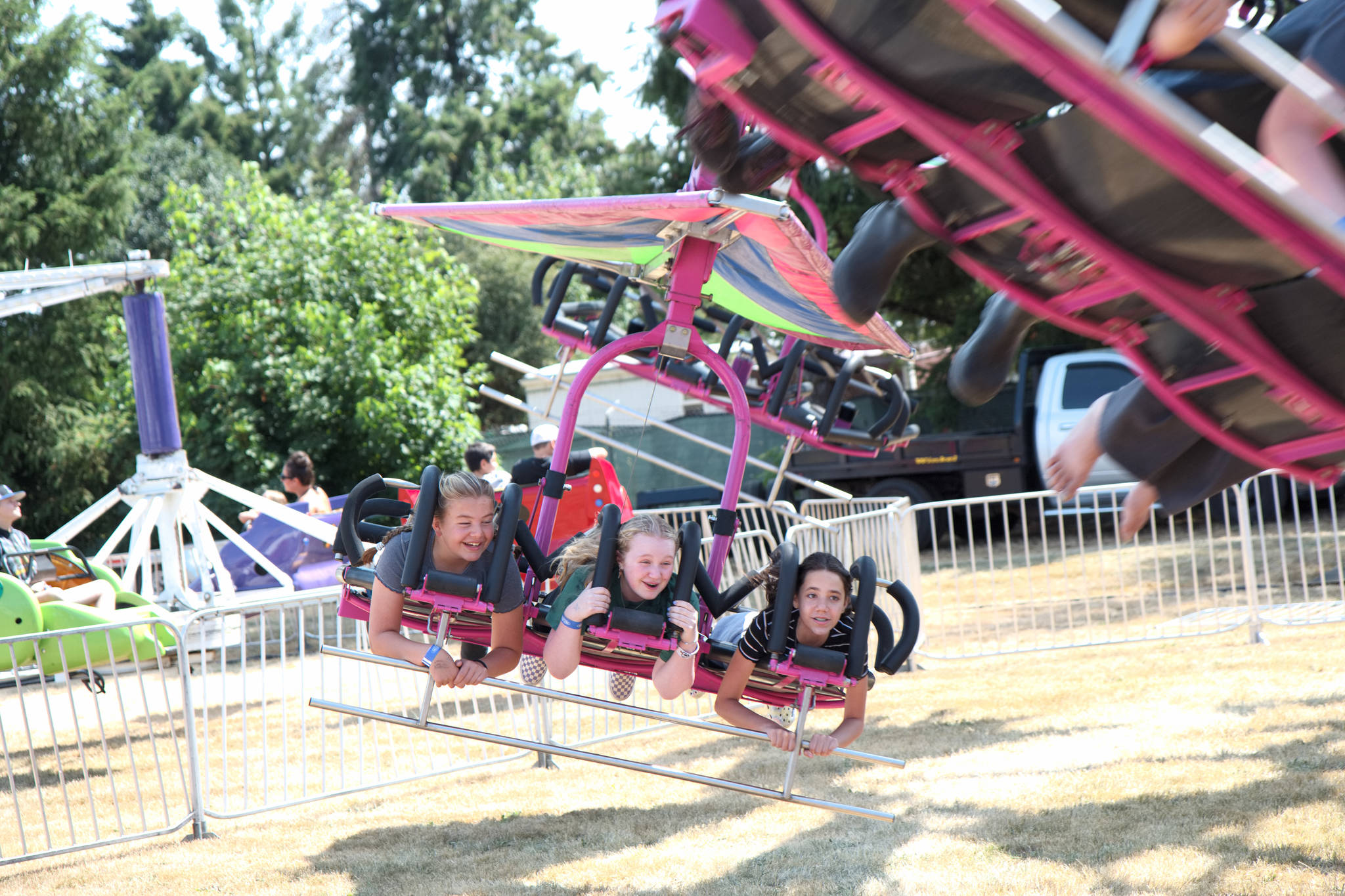 RYAN SPARKS | THE DAILY WORLD Fair patrons enjoy a trip on the Wind Glider ride at the Grays Harbor County Fair on Thursday in Elma.