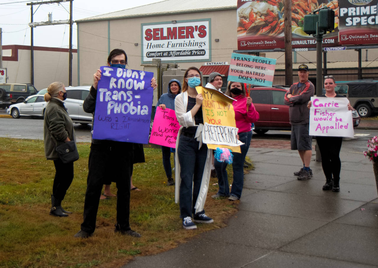 RYAN SPARKS | THE DAILY WORLD Approximately one dozen pro-trans rights supporters protested outside of the Sucher & Sons Star Wars Shop on Saturday in Aberdeen. A larger contingent of protesters was expected before groups organizing the protests canceled the event Friday evening.