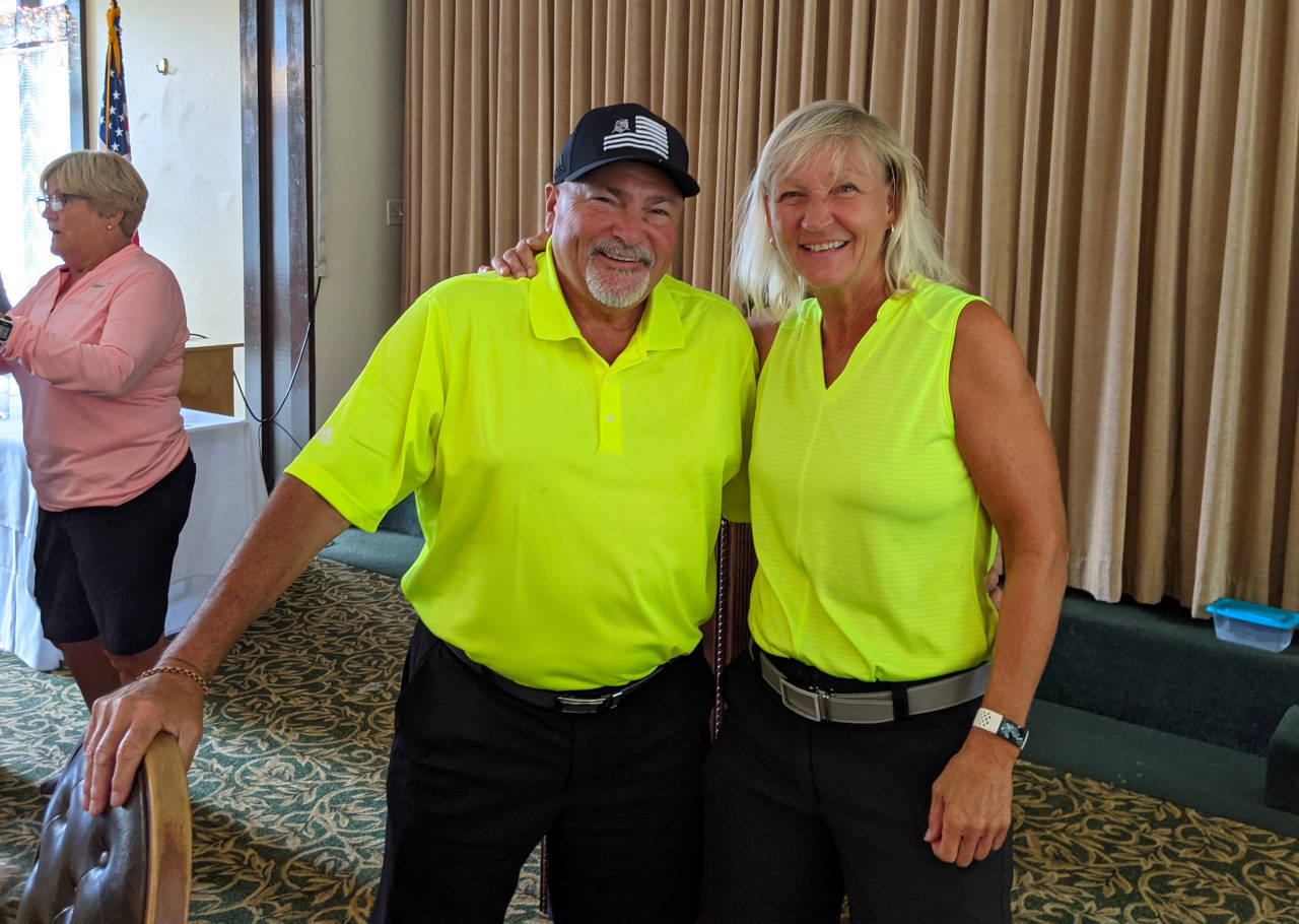 SUBMITTED PHOTO
Ed and Gretchen Klein pose for a photo after winning the Kitsap Couples Tournament on Aug. 8. The pair shot a 6-under 31 on the back nine to come back from nine shots down to win the tournament.