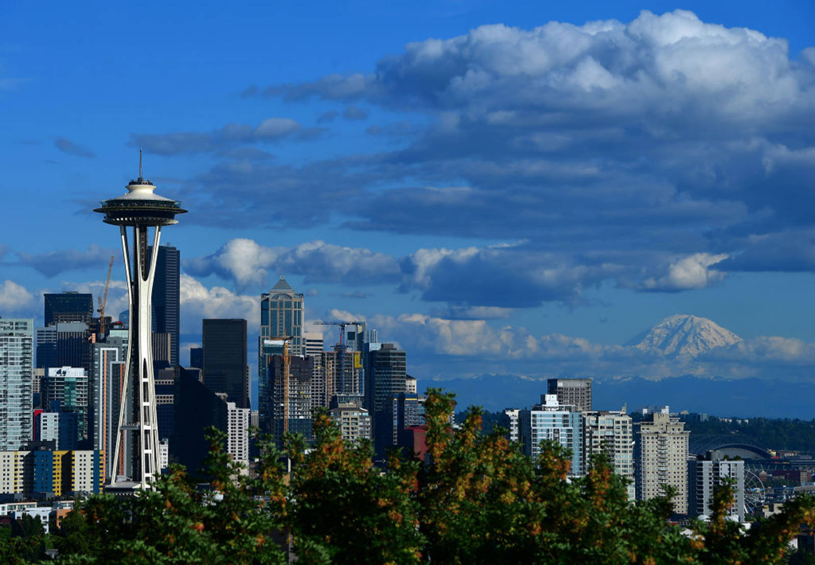 Donald Miralle | Getty Images
A general view of the Seattle Space Needle and downtown skyline with Mount Rainier in the background on June 8, 2019, in Seattle.