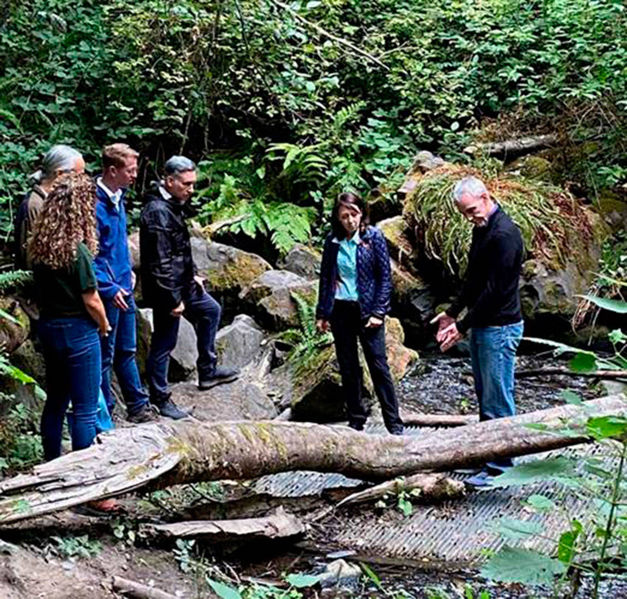 Courtesy of U.S. Rep. Derek Kilmer 
Evan Lewis, Special Projects Manager, King Country Fish Passage Restoration Program (right) shows example of a culvert in need of repair at Carkeek Park in Seattle to U.S. Sen. Maria Cantwell and U.S. Rep. Derek Kilmer.