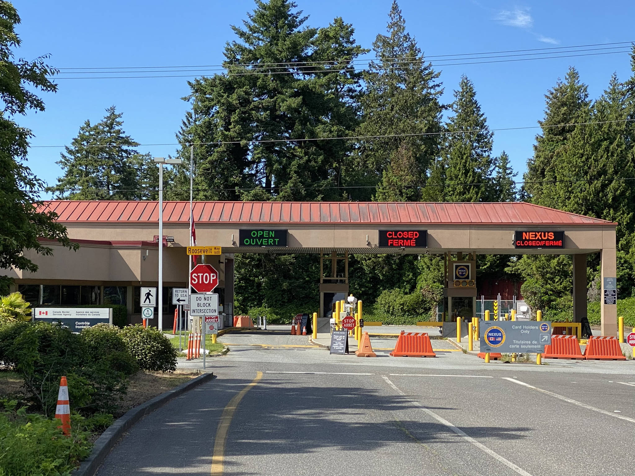 Richard Read | Los Angeles Times, file photo 
Exit lanes from Point Roberts sit empty at the local Canadian border station, which was shut down to all but essential travel during the COVID-19 pandemic.