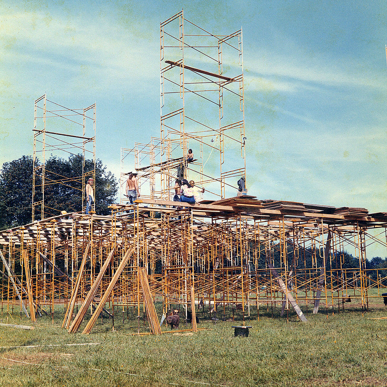 Workers put together the massive stage at the 1971 Satsop River music festival. 	courtesy of darrell Westmoreland