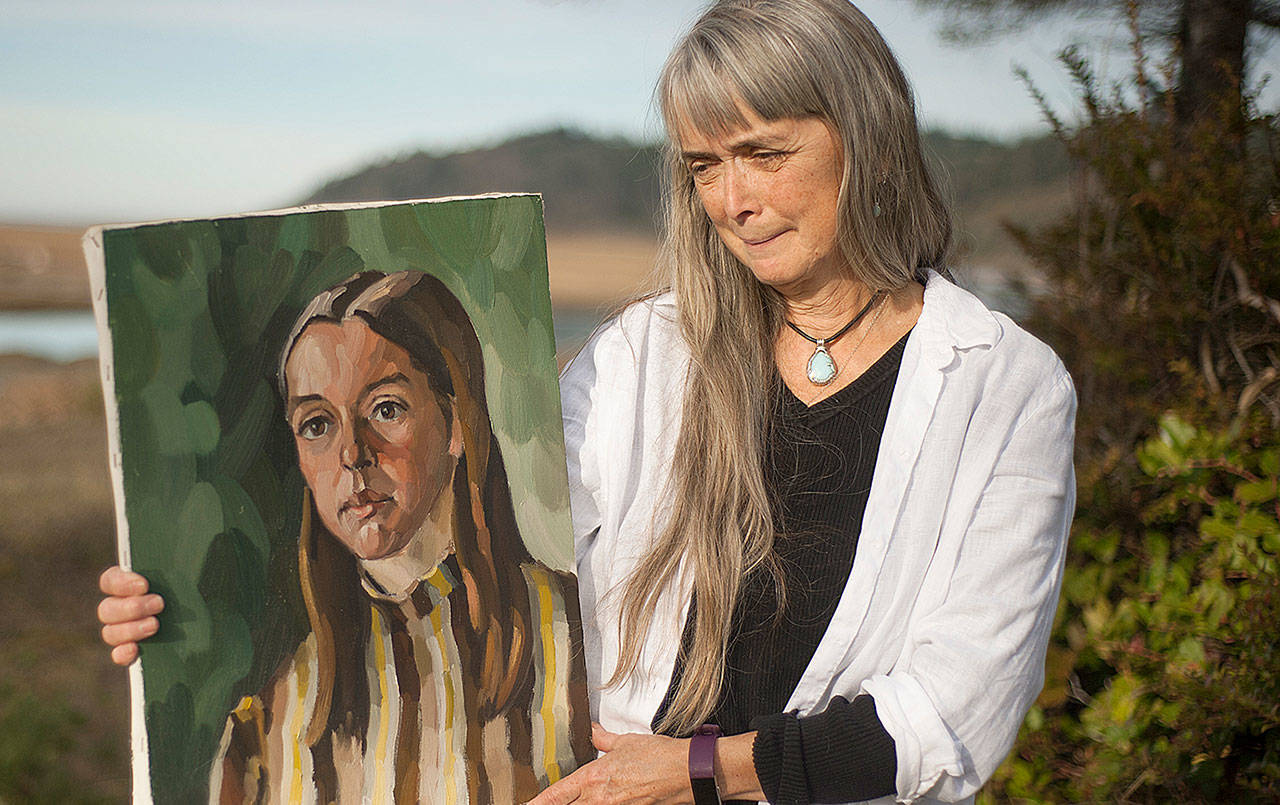 photos by Judith Altruda 
Shoalwater Bay Tribe member Mary Downs with a portrait Eugene Landry painted of her in 1969. It will be part of the display of Landry’s works at the tribe’s museum starting Sept. 17, 2021.