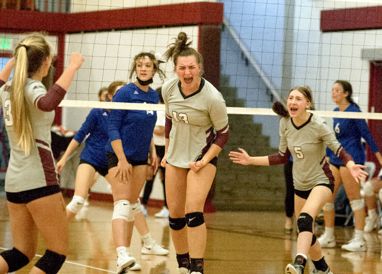 RYAN SPARKS | THE DAILY WORLD The Montesano Bulldogs celebrate a point on Thursday at the Hoquiam Volleyball Jamboree at Hoquiam Square Garden.