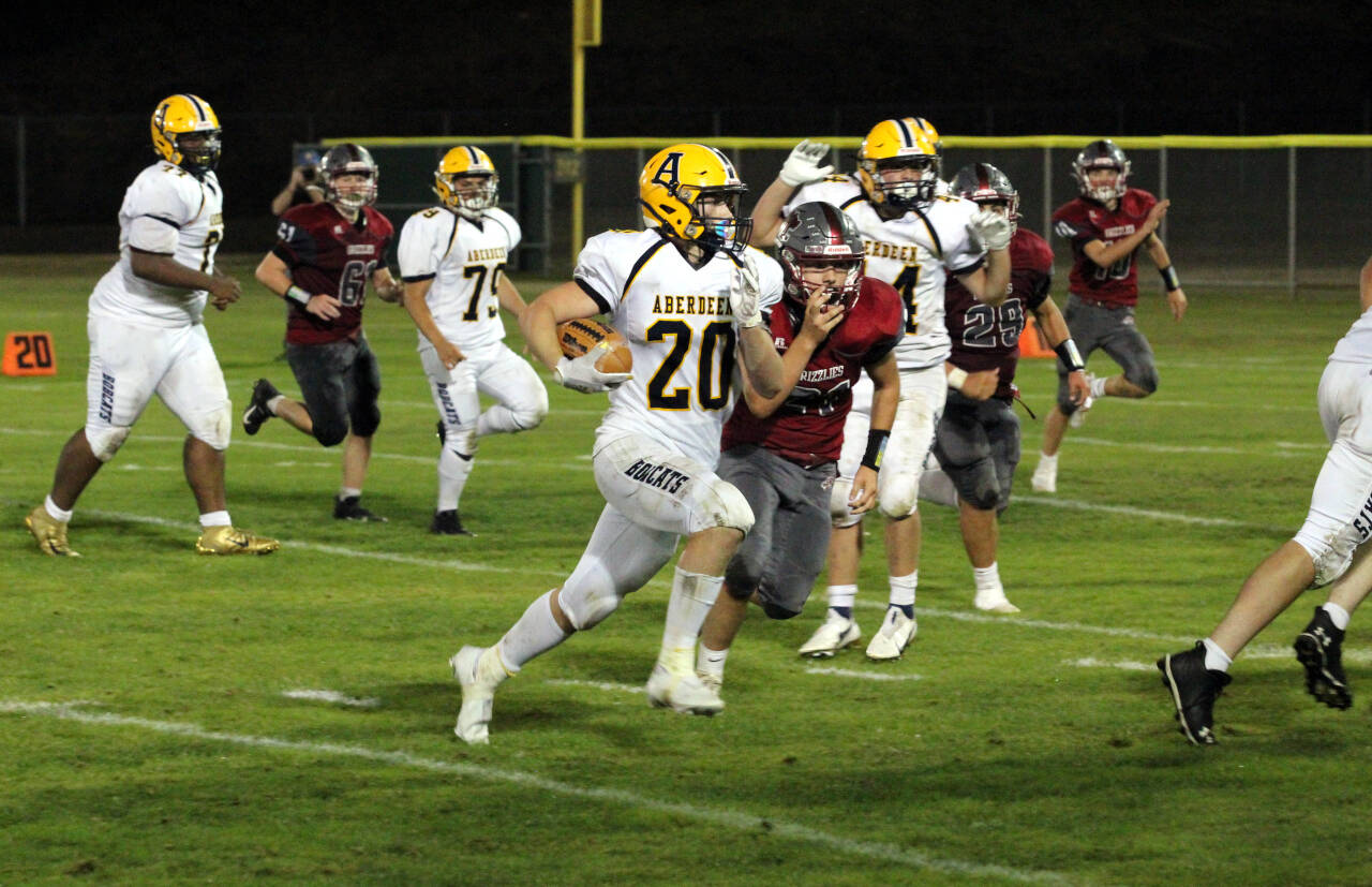 PHOTO BY BEN WINKELMAN Aberdeen running back Jeremy Sawyer (20) ran for 149 yards and a touchdown to lead the Bobcats to a 40-8 victory over Hoquiam on Friday in Hoquiam.