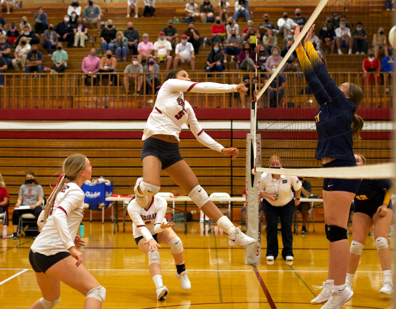 PHOTO BY PATTI REYNVAAN Hoquiam’s Chloe Kennedy (5) rises for a kill during the Grizzlies’ straight-set, season-opening victory over Aberdeen on Tuesday in Hoquiam.
