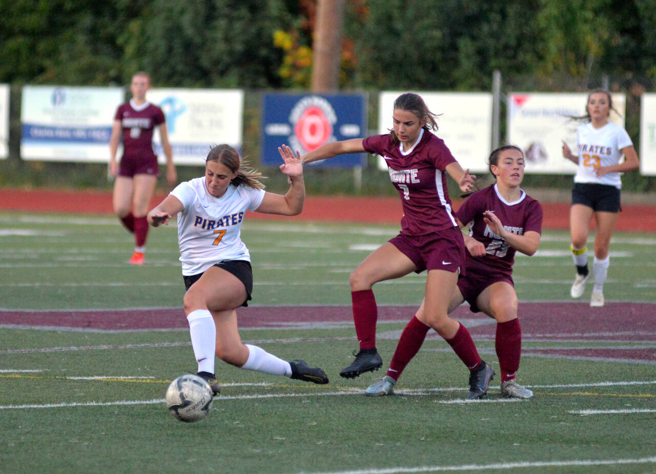 RYAN SPARKS | THE DAILY WORLD Adna’s Karlee VonMoss, left, collides with Montesano’s Jaiden Morrison and Jaiden King (23) during the Bulldogs” 4-1 win on Wednesday at Jack Rottle Field in Montesano.