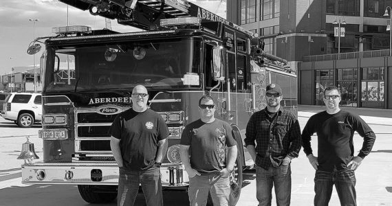photo by hughes fire equipment inc. | FILE
Aberdeen Fire Department personnel stand next to a new pumper truck and skyboom in May 2020. Pictured from left are firefighter Brian Peterson, Capt. Mike Kolodzie, Capt. Sam Baretich and Engineer Brad Frafjord.