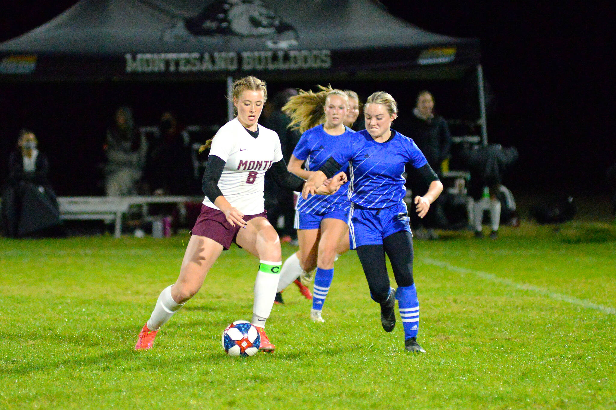 RYAN SPARKS | THE DAILY WORLD Montesano midfielder Paige Lisherness (8) and Elma’s Janessa Sample compete for possession during Monte’s 4-0 win on Tuesday in Elma.