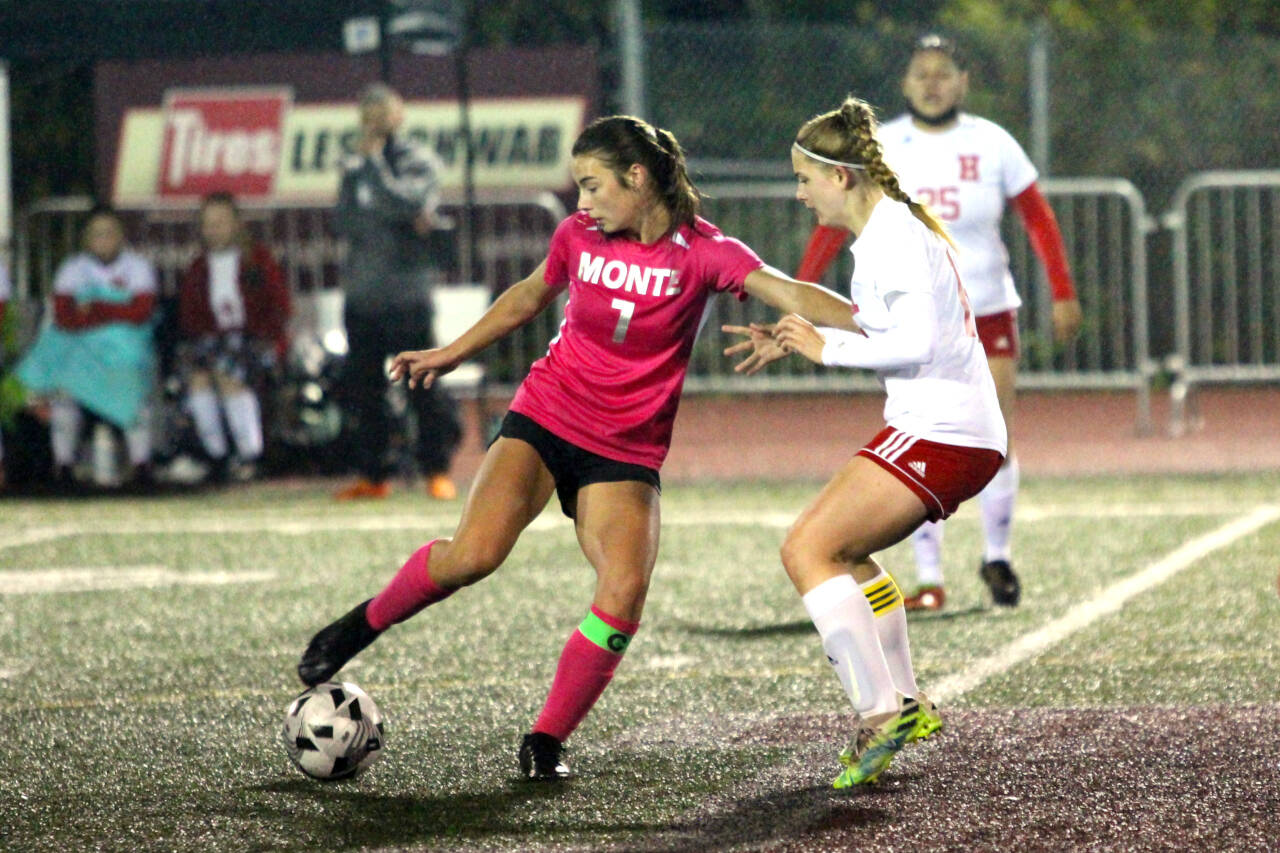 PHOTO BY BEN WINKELMAN Montesano’s Jaiden Morrison (7) controls possession while being defended by Hoquiam’s Ellie Winkelman during the Bulldogs’ 8-1 victory on Tuesday at Jack Rottle Field in Montesano.