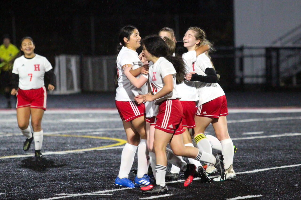 PHOTO BY BEN WINKELMAN Hoquiam midfielder Emma Johnson, right, is congratulated by her teammates after scoring a goal in the 70th minute in the Grizzlies 2-1 loss to Tenino on Tuesday at Tenino High School.