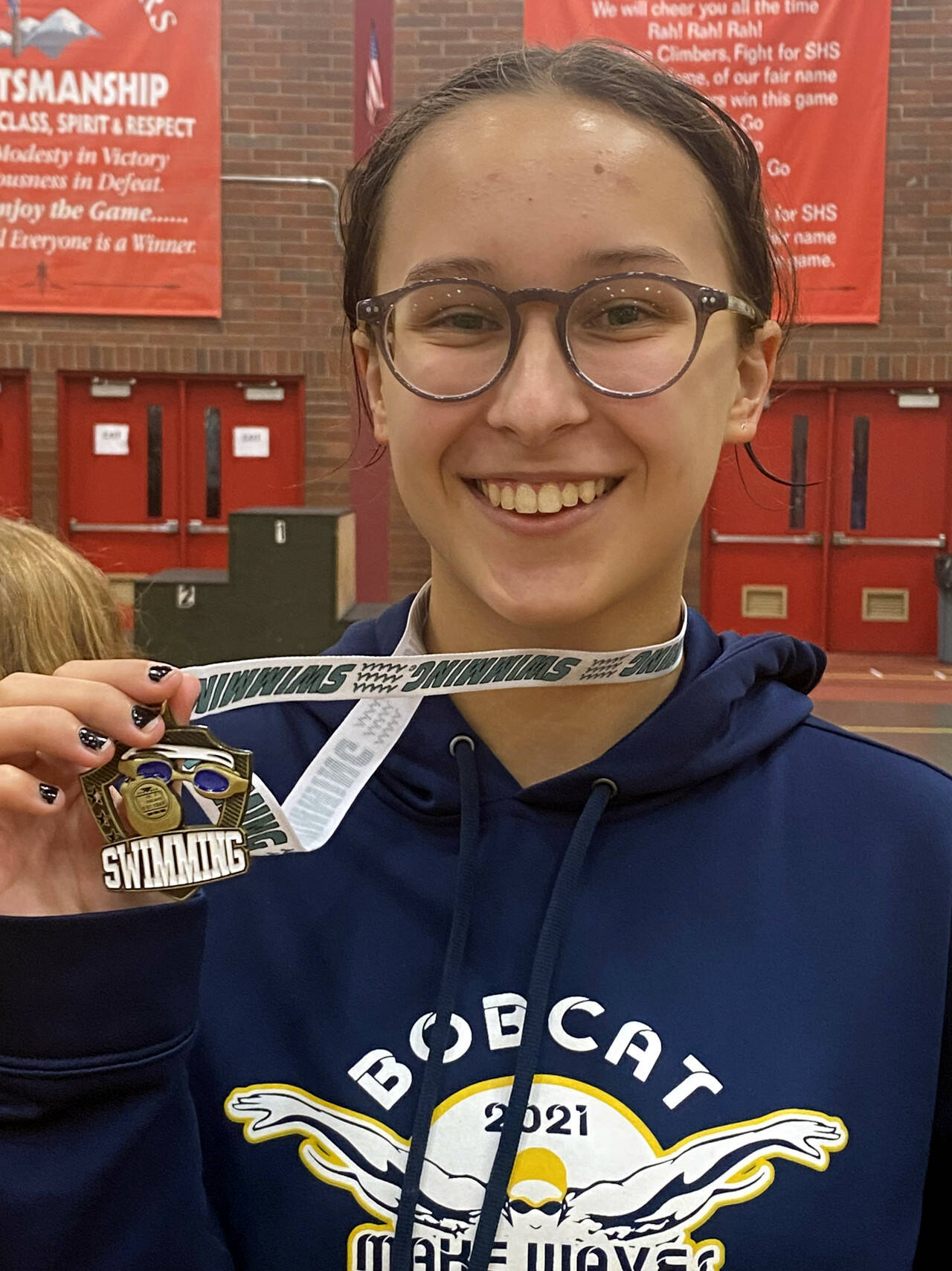 SUBMITTED PHOTO Aberdeen swimmer Anna Matisons shows off her district-championships medal after winning the 100 yard breaststroke at the 2A/1A District 4 Girls Swim & Dive Championship Meet on Saturday at Shelton High School.