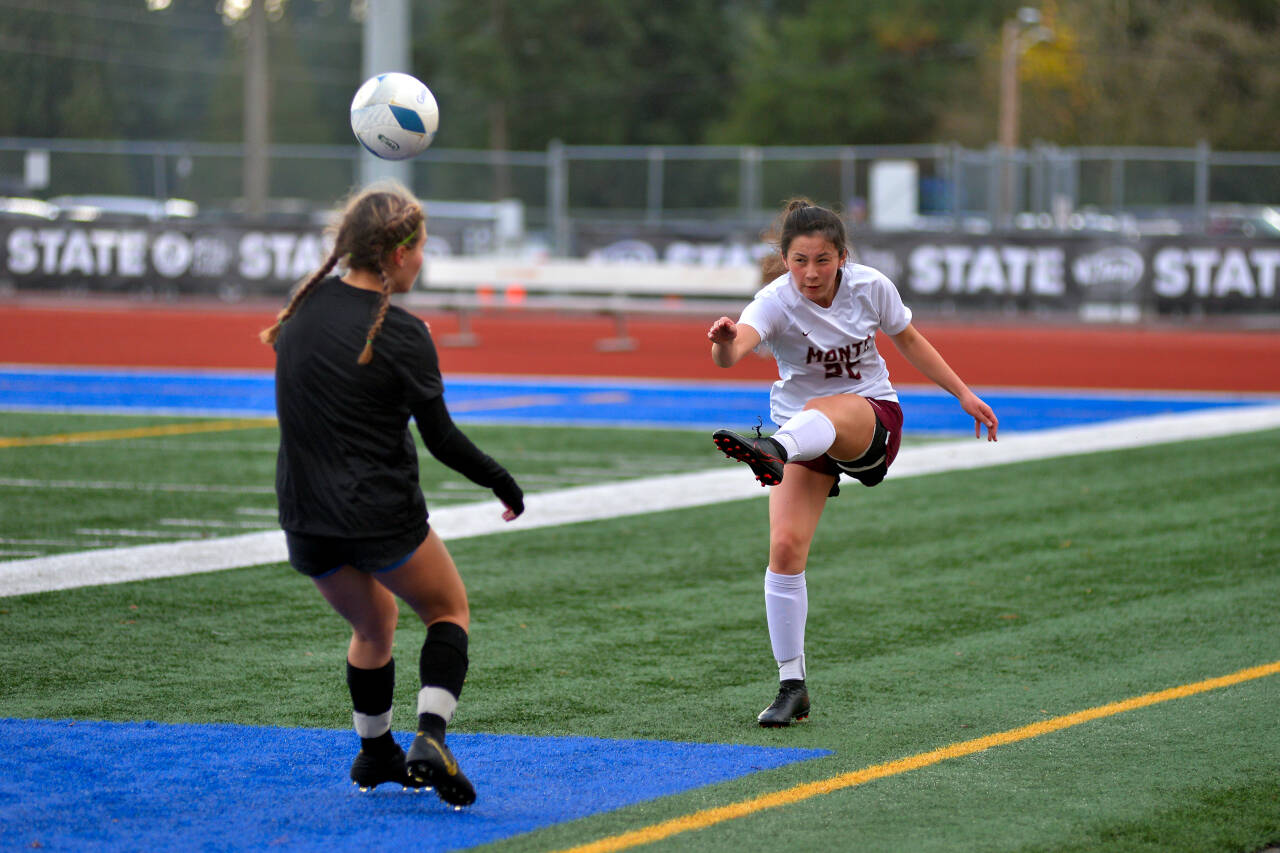 RYAN SPARKS | THE DAILY WORLD
Montesano's Bethanie Henderson (22) sends the ball forward against Klahowya's Mya Young during Monte's 5-0 loss in the state's third/fourth-place game on Saturday at Shoreline Stadium in Shoreline.