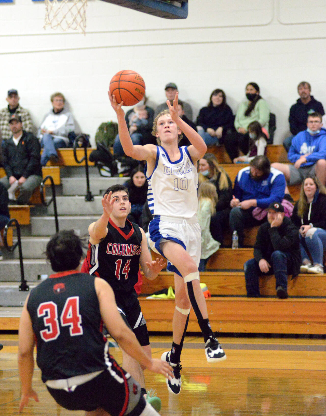 RYAN SPARKS | THE DAILY WORLD
Elma's Cason Seaberg (10) drives to the basket against Columbia-White Salmon's Dylan Connely (14) during the Eagles 69-46 victory on Friday in Elma.