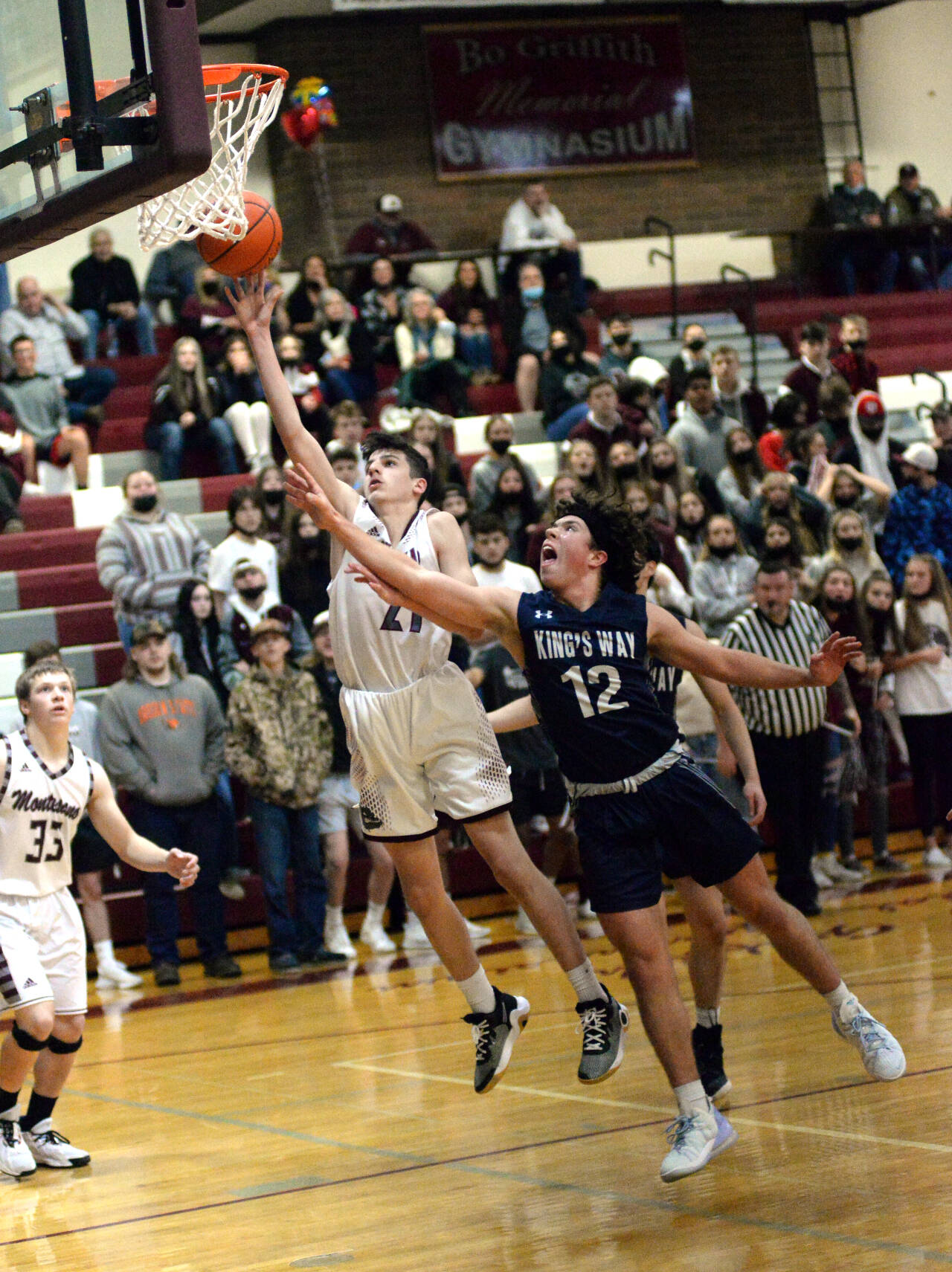 RYAN SPARKS | THE DAILY WORLD
Montesano's Christian Olsen shoots while being defended by King's Way Christian's Isaac Pisarczyk during the Bulldogs 62-30 loss on Friday in Montesano.