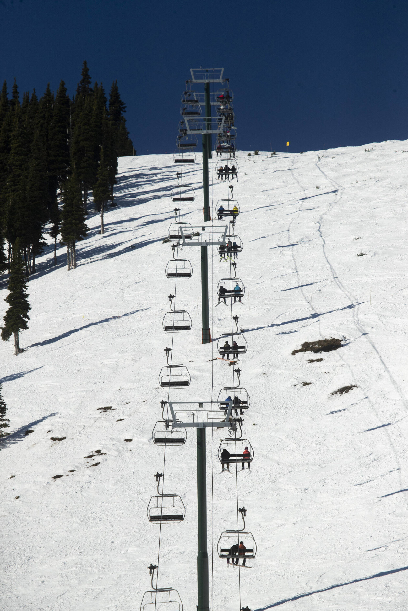 Skiers ride the Rainier Express at Crystal Mountain ski resort on Dec. 2, 2020. Erika Schultz | Seattle Times, File Photo