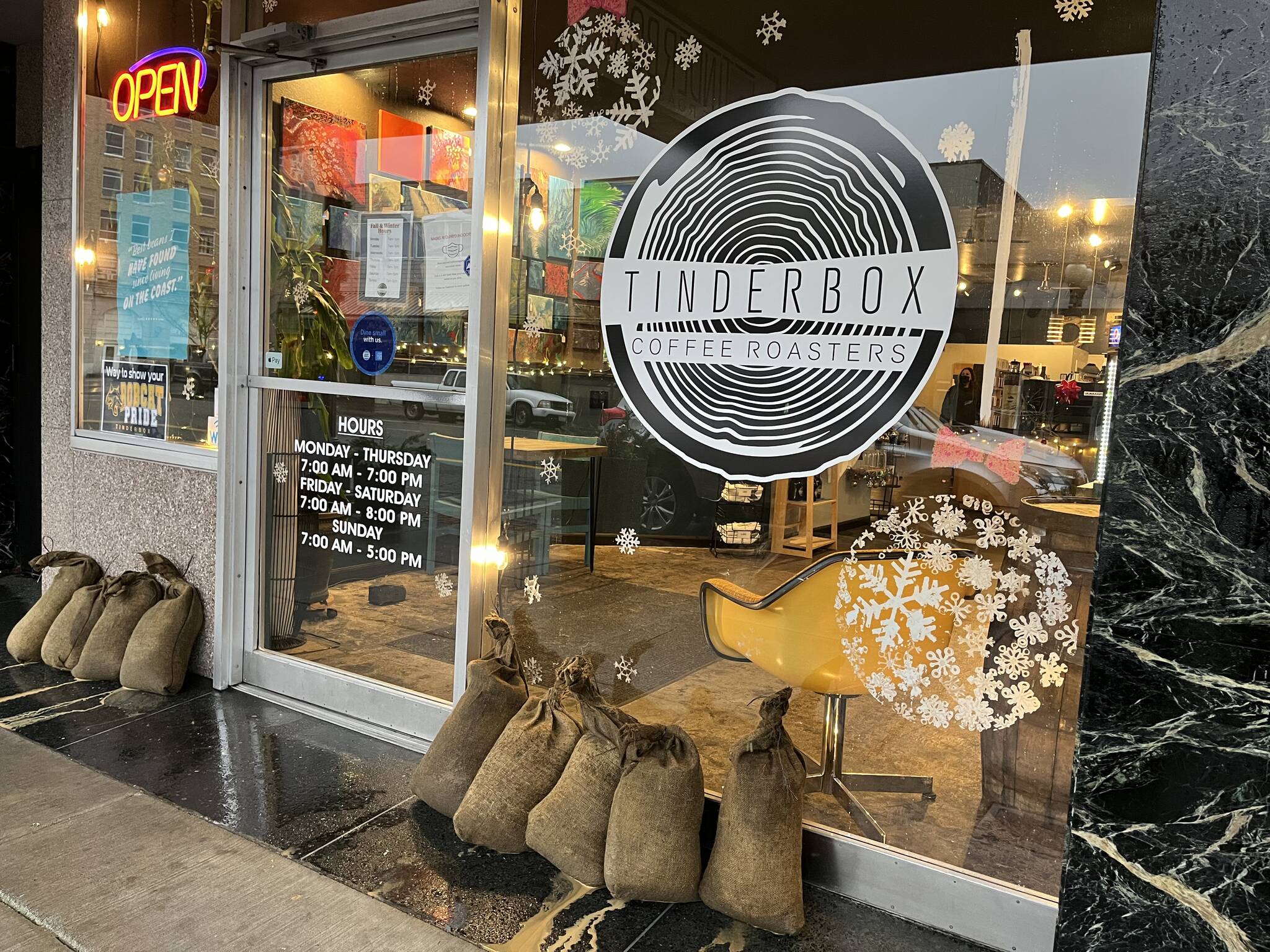 Leon O'Donnell, barista at Tinderbox Roasters, 113 E Wishkah St., said Thursday morning, Jan. 6, 2022, that his boss brought in sandbags to help when high tide comes in. Matthew N. Wells | The Daily World