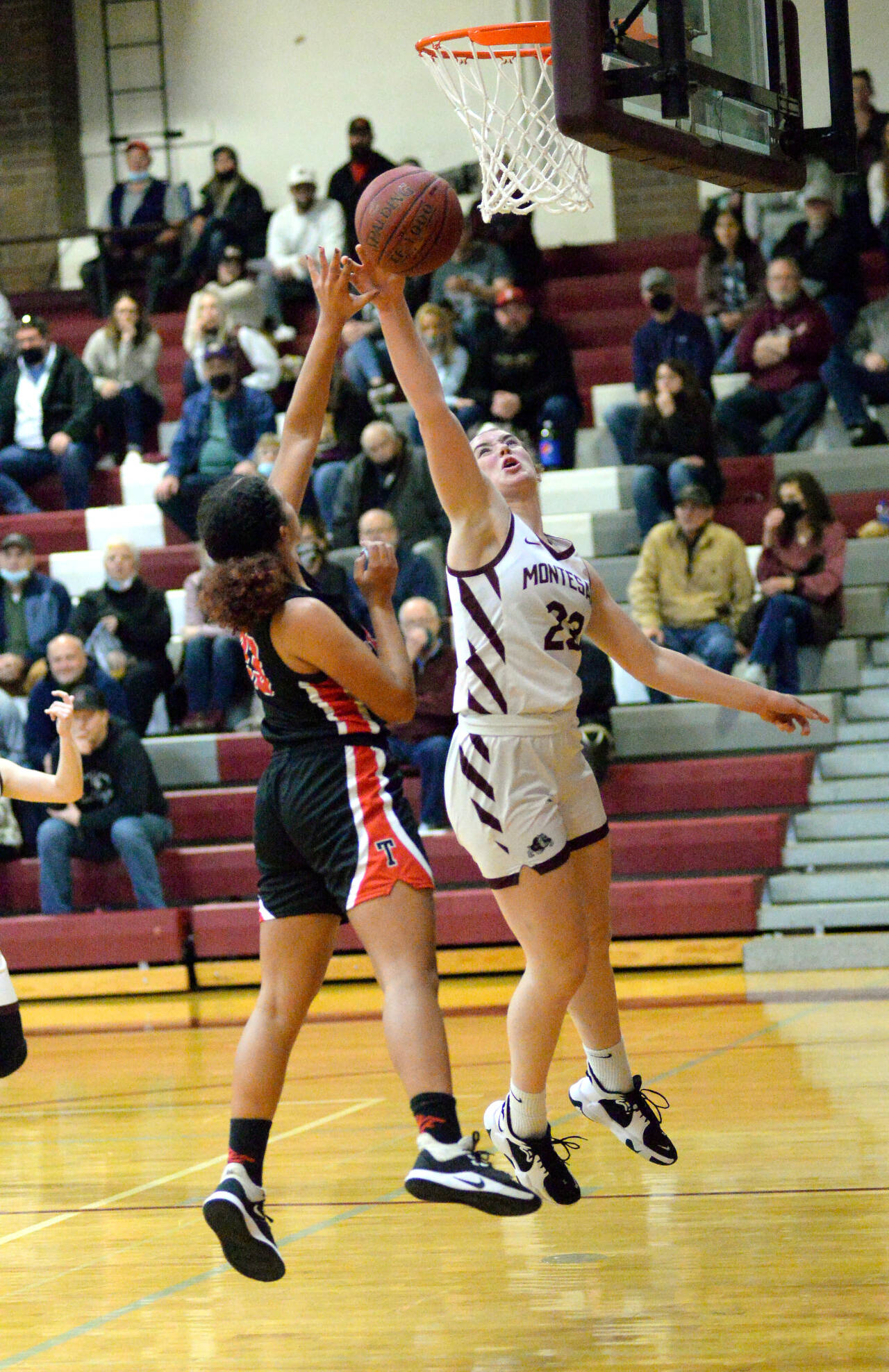 RYAN SPARKS | THE DAILY WORLD Montesano senior Paige Lisherness (23) blocks a shot from Tenino’s Alivia Hunter during the third quarter of the Bulldogs 51-43 victory on Friday in Montesano.