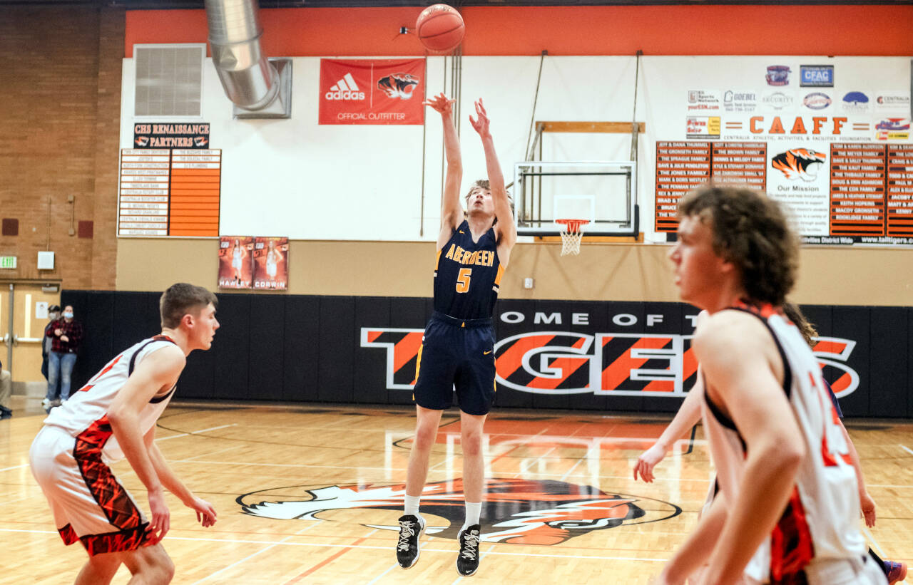 JARED WENZELBURGER | THE CHRONICLE Aberdeen senior Andrew Troeh (5) puts up a shot during Aberdeen’s 69-67 loss to the Centralia Tigers Friday in Centralia. Troeh led the Bobcats with 20 points.