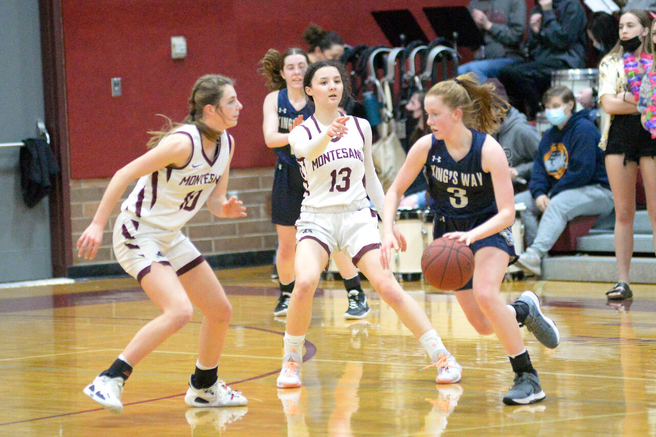 RYAN SPARKS | THE DAILY WORLD Montesano’s Mikayla Stanfield (10) and Maia Young (13) defend against King’s Way Christian guard Bridget Quinn during the Bulldogs’ 53-39 victory in the 1A District 4 semifinals on Tuesday in Montesano.