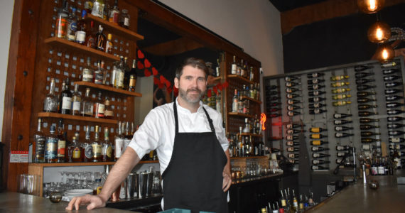 Rediviva’s owner and Chef Andy Bickar proudly stands behind his bar, his staff and his food. The 2000 Aberdeen High School graduate crafts locally-sourced food in such a way that guests leave full and happy. (Matthew N. Wells | The Daily World)