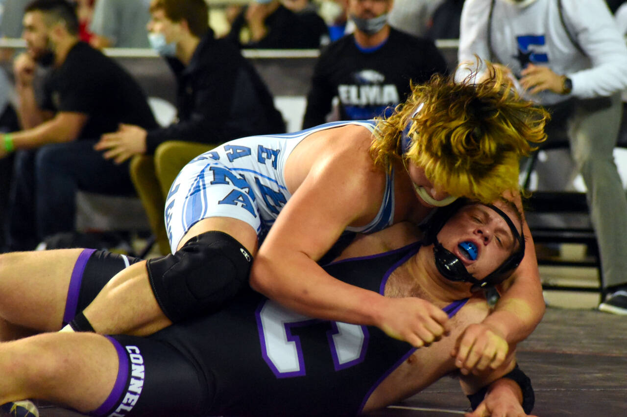 PHOTO BY SUE MICHALAK BUDSBERG Elma’s Austin Salazar, top, wrestles at the Mat Classic XXXII state-championship tournament on Friday at the Tacoma Dome.
