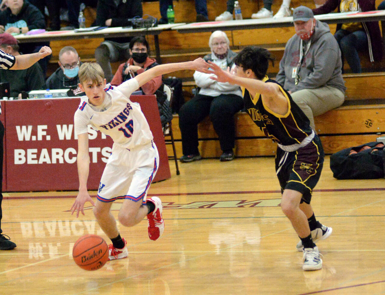 RYAN SPARKS | THE DAILY WORLD Willapa Valley guard Riley Pearson (10) is defended by Sunnyside Christian’s Jaden Jech during the Vikings’ 65-59 victory in a 1B Regional round game on Saturday at WF West High School in Chehalis.