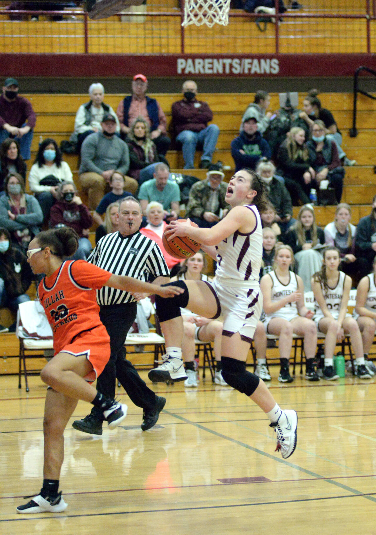 RYAN SPARKS | THE DAILY WORLD Montesano guard Jaiden King, right, is fouled by Zillah’s Talani Oliver while driving to the basket during Montesano’s 59-52 win over Zillah in a 1A Regional game on Saturday at WF West High School in Chehalis.