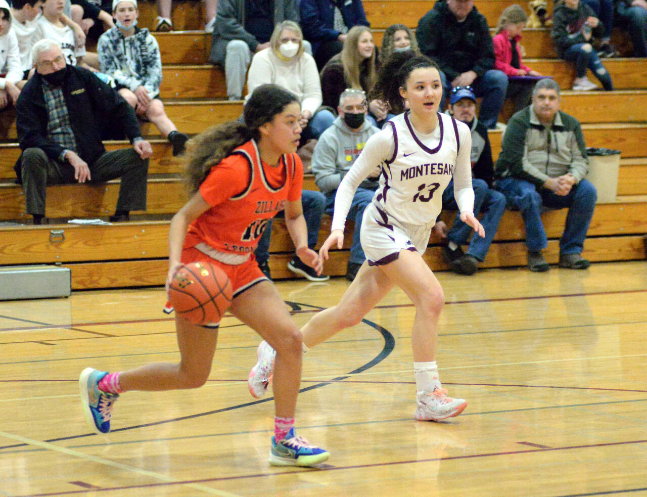 RYAN SPARKS | THE DAILY WORLD Montesano’s Maia Young (13) defends Zillah guard Mia Hicks during the Bulldogs’ 59-52 regional-round victory on Saturday at WF West High School in Chehalis.