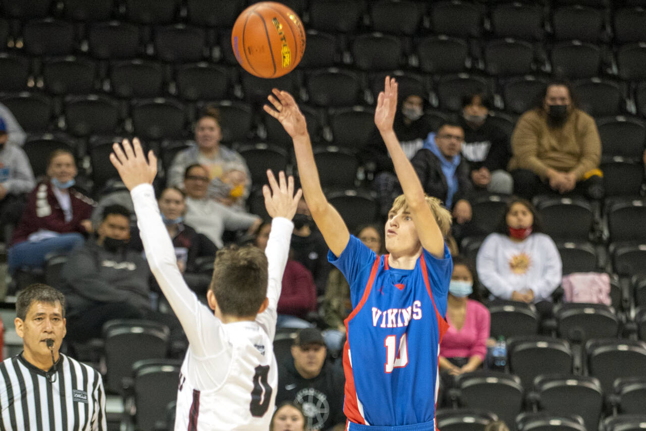 ERIC TRENT | THE CHRONICLE Willapa Valley guard Riley Pearson, right, set a 1B State Tournament single-game record with nine made 3-pointers in a 65-59 loss to Lummi Nation on Friday at the Spokane Arena.